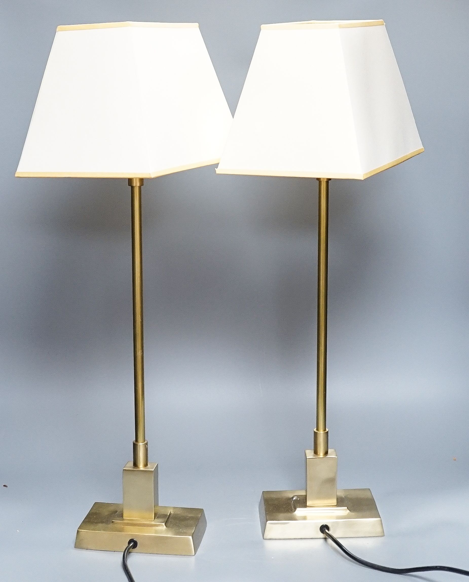 A pair of okra brass lamps